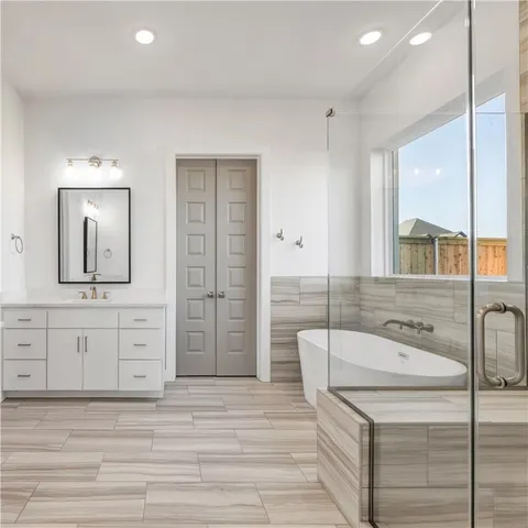 a kitchen with kitchen island granite countertop wooden cabinets and a sink