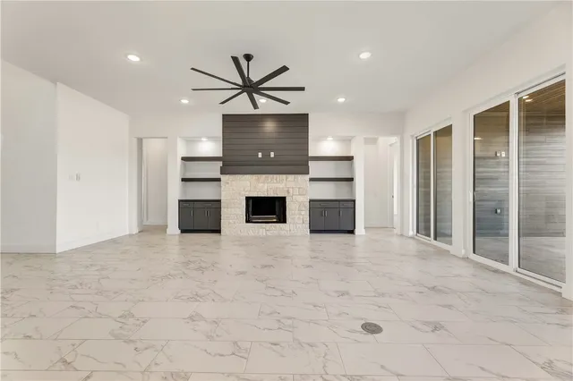 a view of a kitchen with a sink and a refrigerator