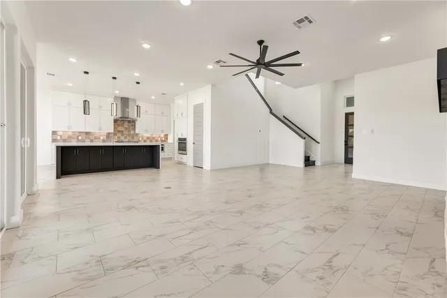 a view of kitchen and kitchen with sink