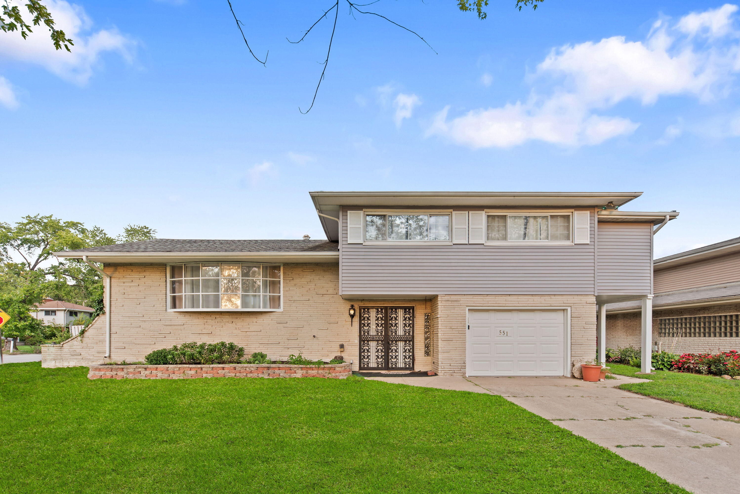 551 Union Place Gary, IN 46403 - Photo 1 of 19 front view of a house with a yard