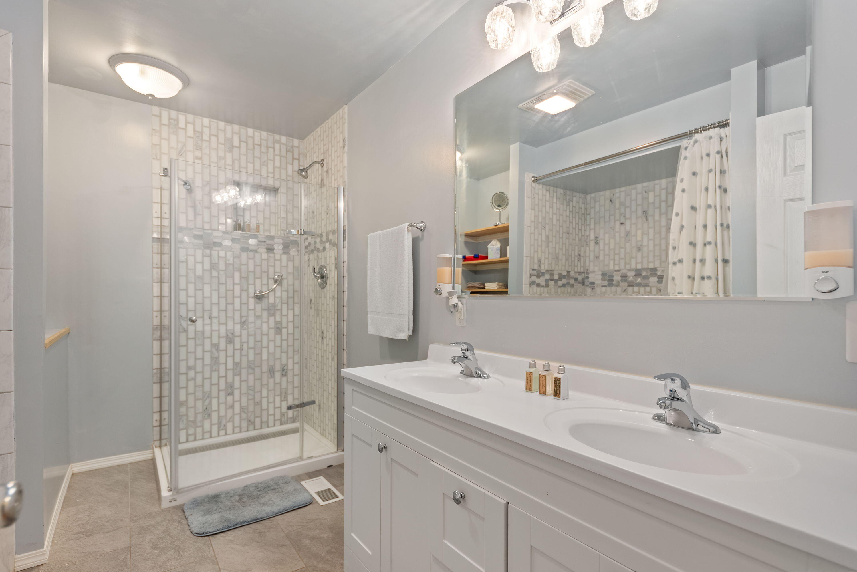 551 Union Place Gary, IN 46403 - Photo 14 of 19 a bathroom with a shower sink vanity and mirror