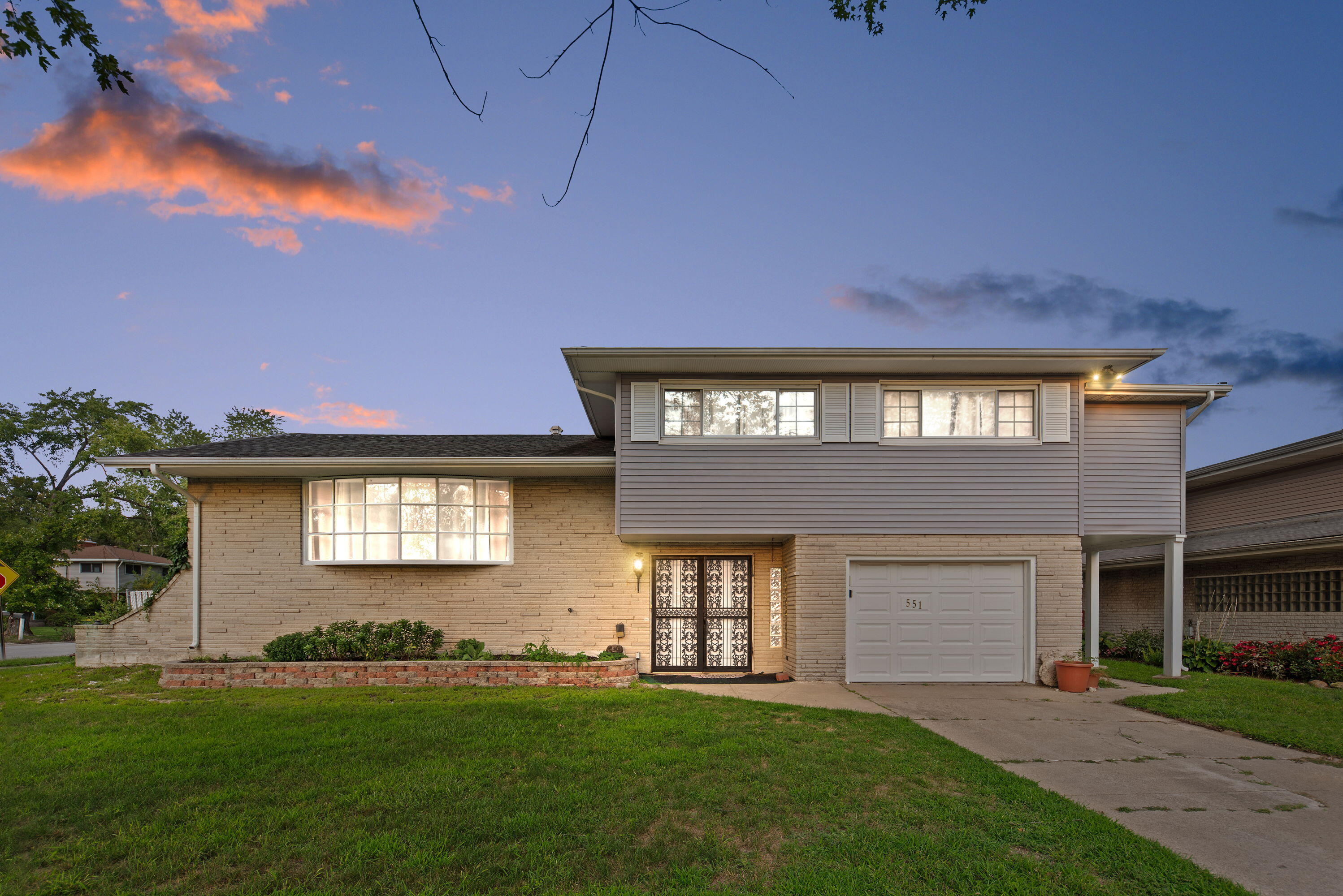 551 Union Place Gary, IN 46403 - Photo 19 of 19 a front view of a house with a yard and garage