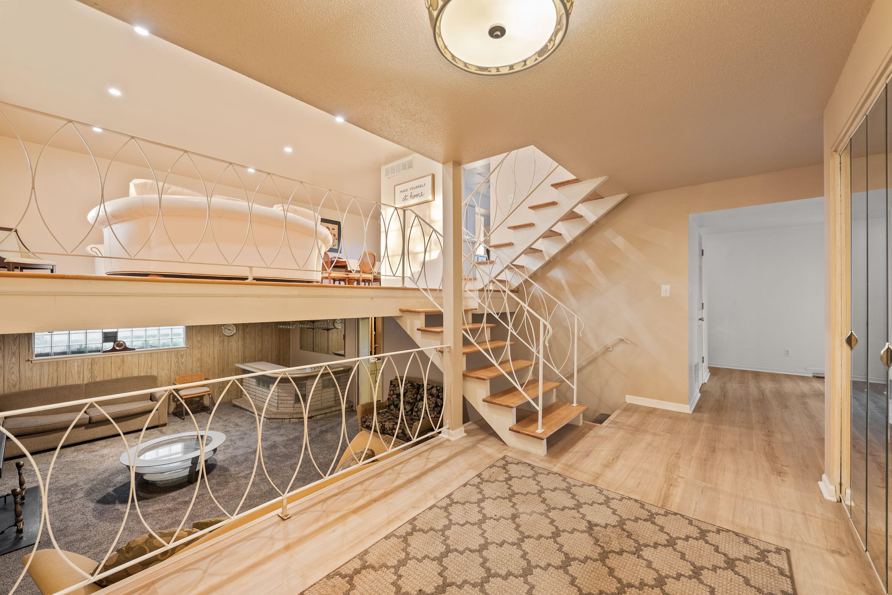 551 Union Place Gary, IN 46403 - Photo 2 of 19 a view of a balcony with floor to ceiling windows and wooden floor