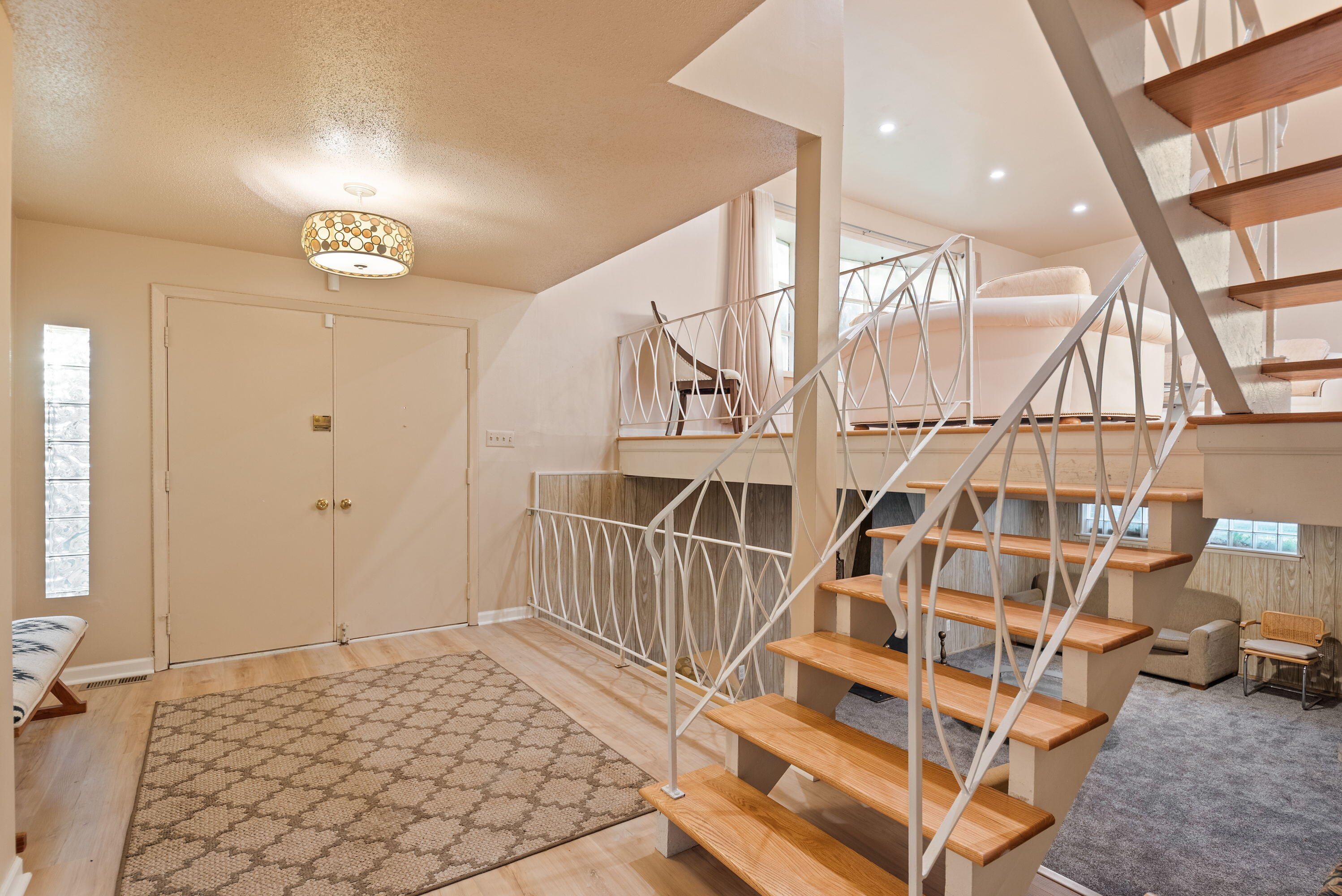 551 Union Place Gary, IN 46403 - Photo 3 of 19 a view of staircase with white walls and wooden floor