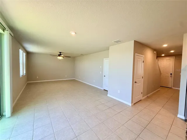 a bathroom with a toilet mirror and sink