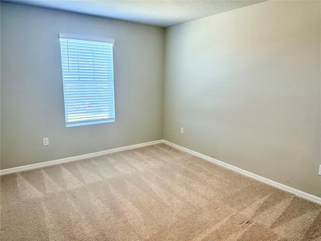 a view of a house with backyard and garden