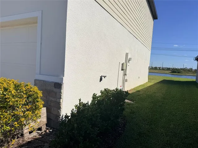 a view of a swimming pool with a yard