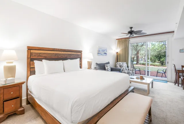 a large bedroom with a large bed and a large window