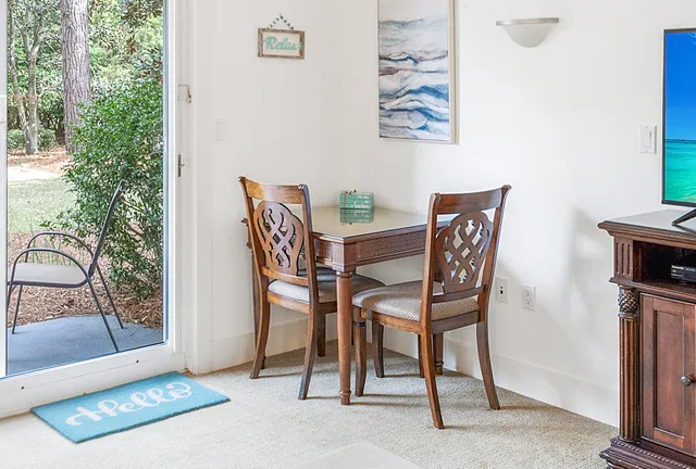 a backyard with table and chairs
