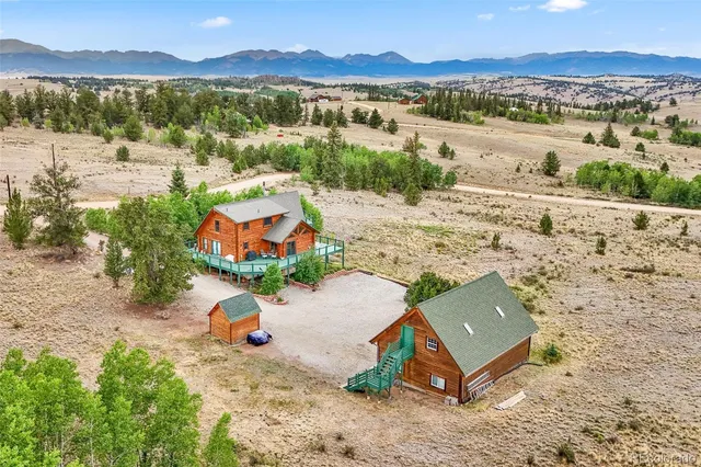 an aerial view of a house with outdoor space