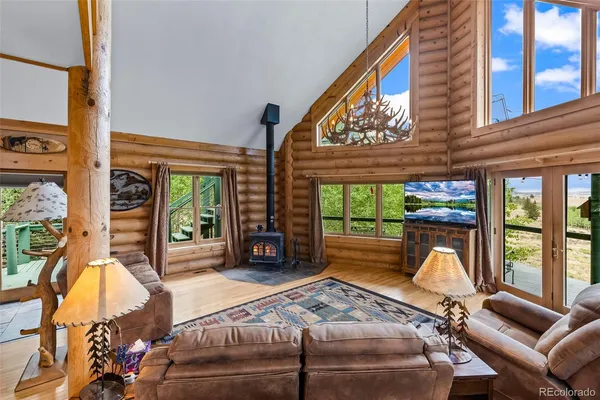 a outdoor living space with furniture and a fireplace