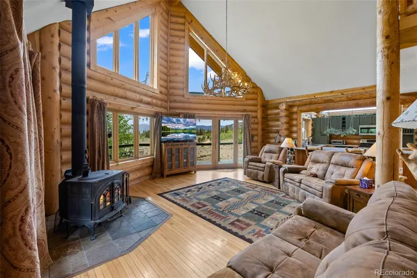 a living room with furniture rug and a table