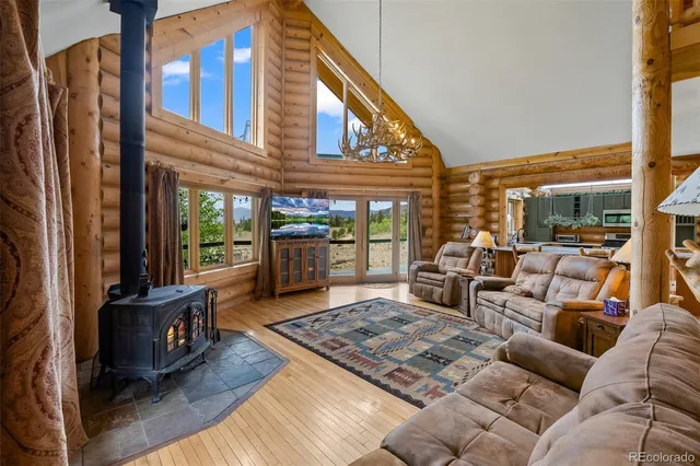 a living room with furniture rug and a table