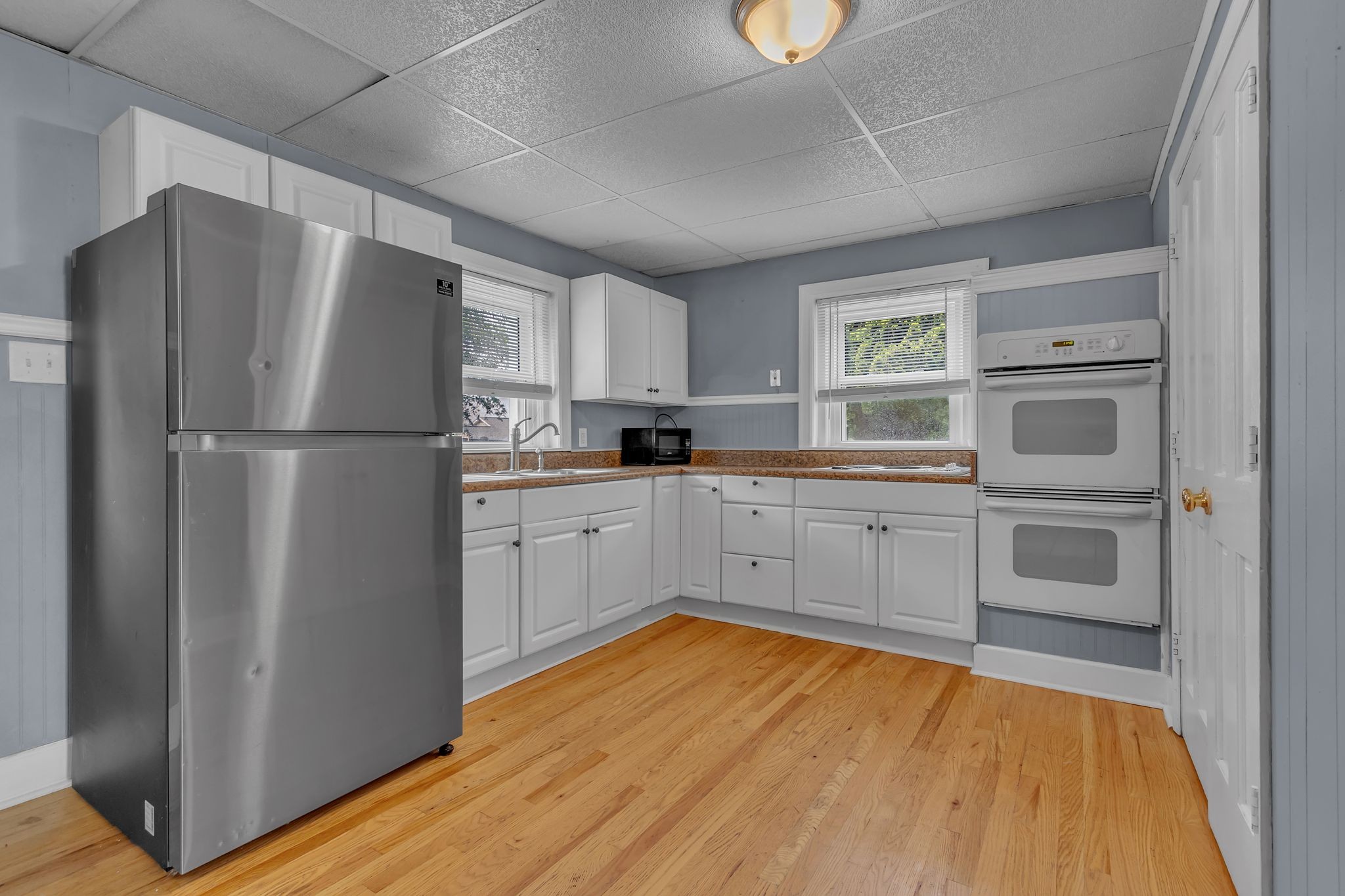 154 Morningside Lane Columbia, TN 38401 - Photo 14 of 26 a kitchen with white cabinets and white appliances