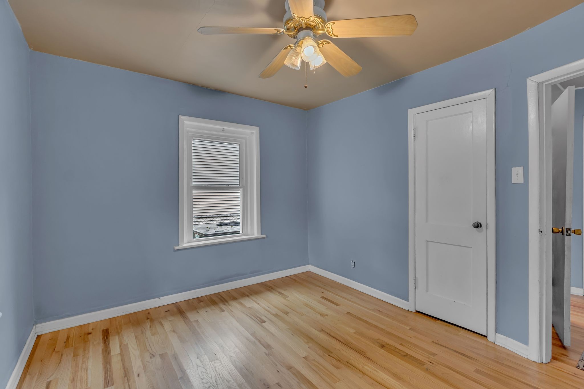 154 Morningside Lane Columbia, TN 38401 - Photo 21 of 26 a view of an empty room with wooden floor and a window