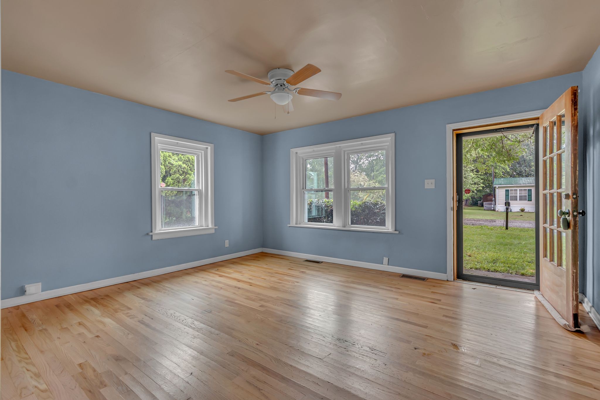 154 Morningside Lane Columbia, TN 38401 - Photo 6 of 26 a view of an empty room with wooden floor and a window