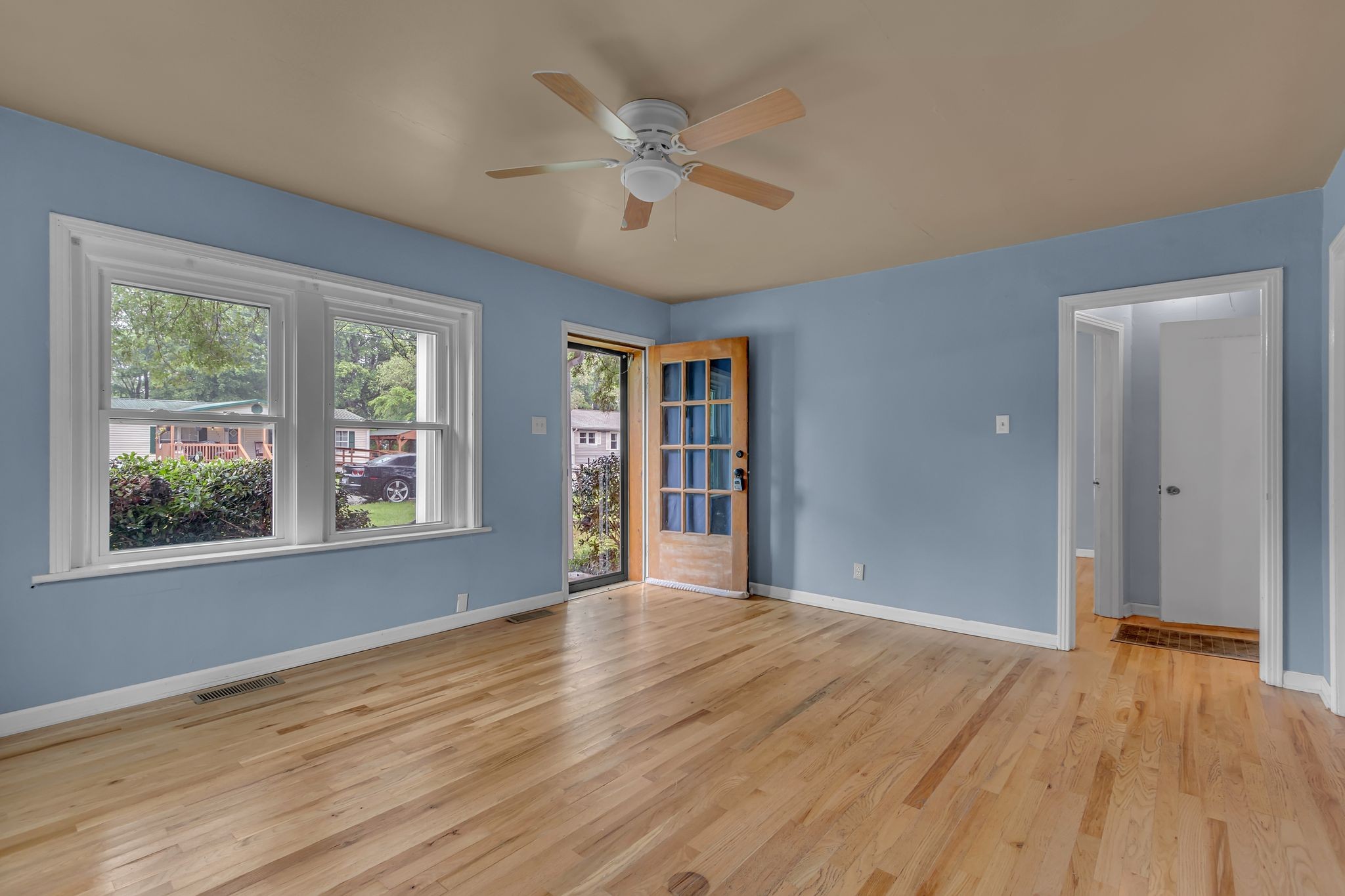 154 Morningside Lane Columbia, TN 38401 - Photo 7 of 26 a view of an empty room with wooden floor and a window