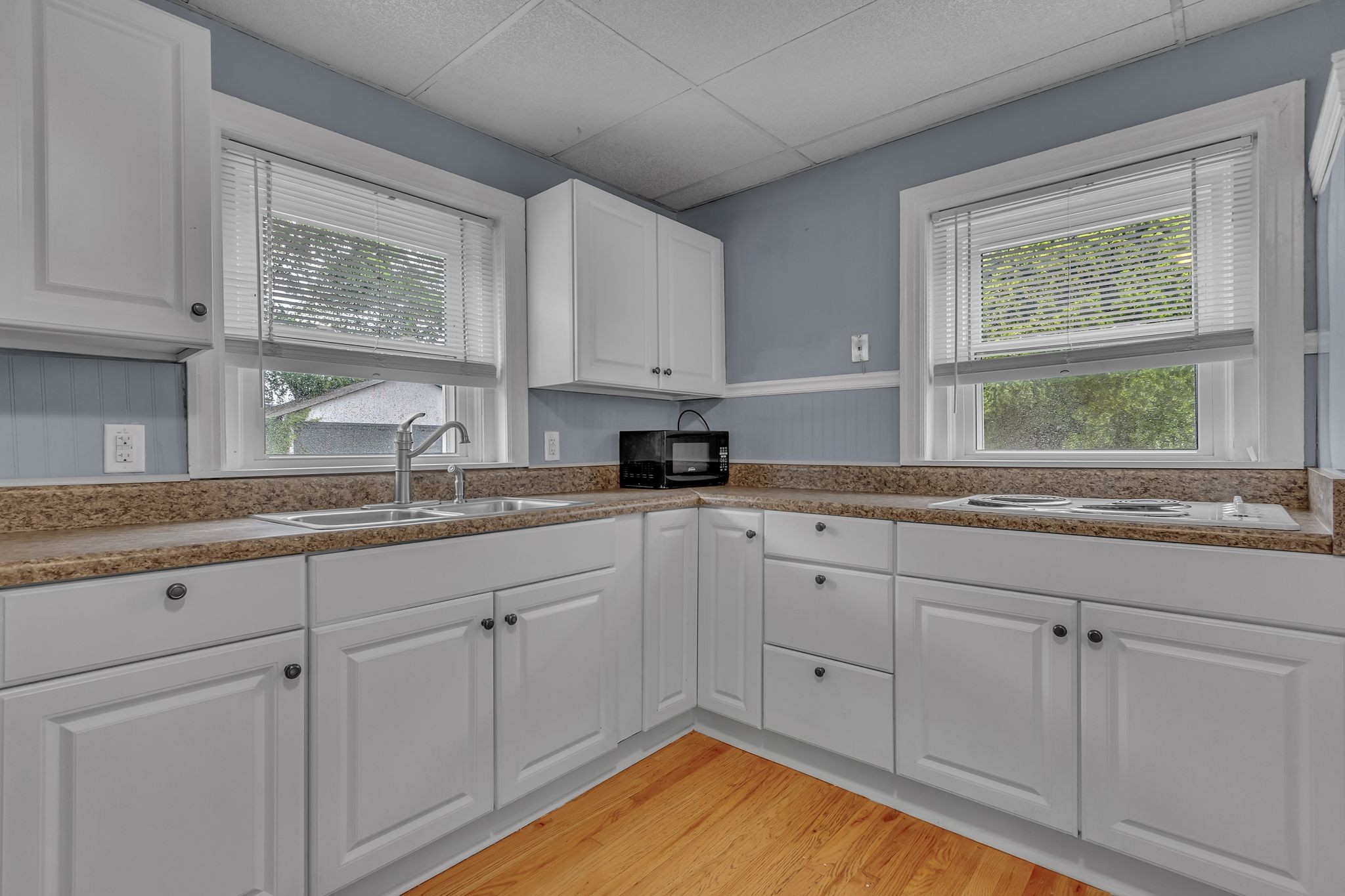 154 Morningside Lane Columbia, TN 38401 - Photo 10 of 26 a kitchen with granite countertop white cabinets sink and window