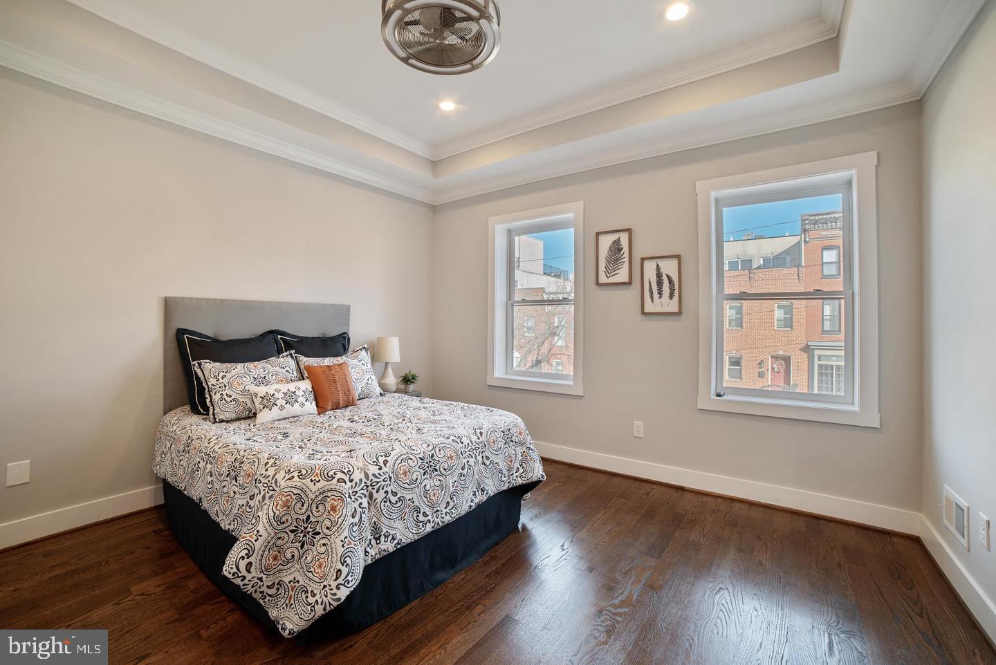 3425 O Donnell Street Baltimore, MD 21224 - Photo 12 of 29 a bedroom with a bed and wooden floor