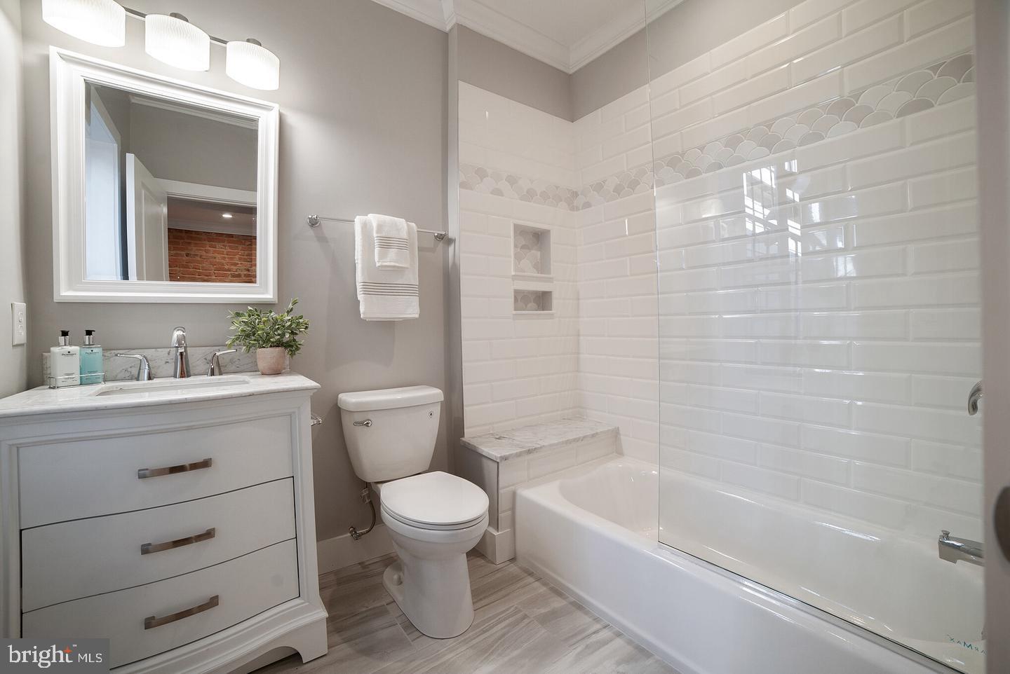 3425 O Donnell Street Baltimore, MD 21224 - Photo 14 of 29 a bathroom with a sink a toilet and shower