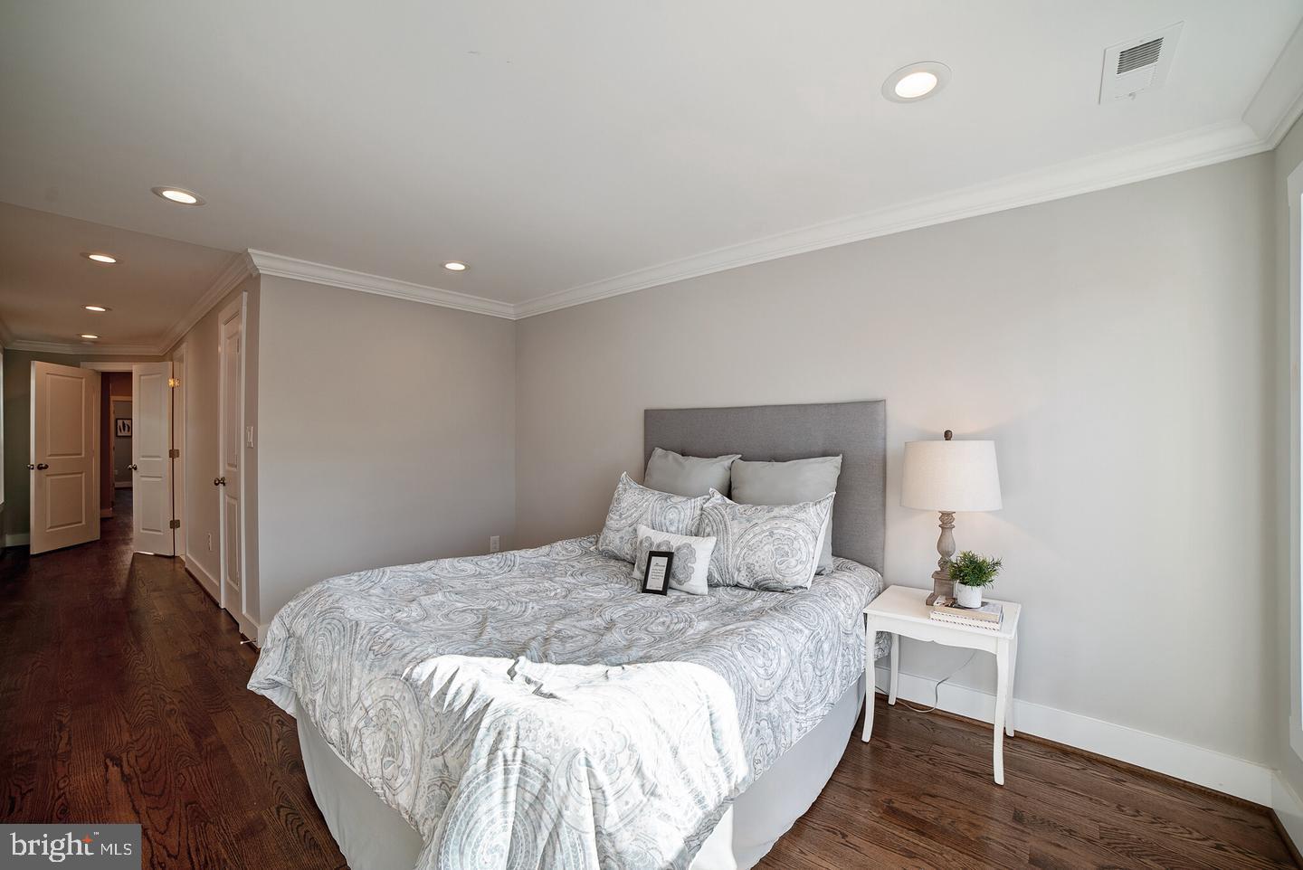 3425 O Donnell Street Baltimore, MD 21224 - Photo 15 of 29 a bedroom with a bed and wooden floor