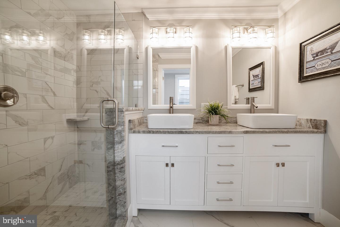 3425 O Donnell Street Baltimore, MD 21224 - Photo 17 of 29 a bathroom with double sink and a mirror