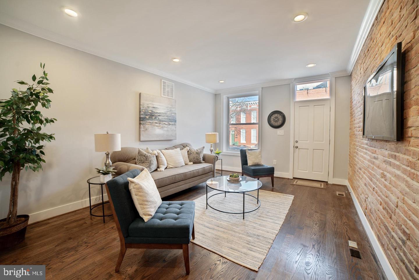 3425 O Donnell Street Baltimore, MD 21224 - Photo 2 of 29 a living room with furniture and a potted plant