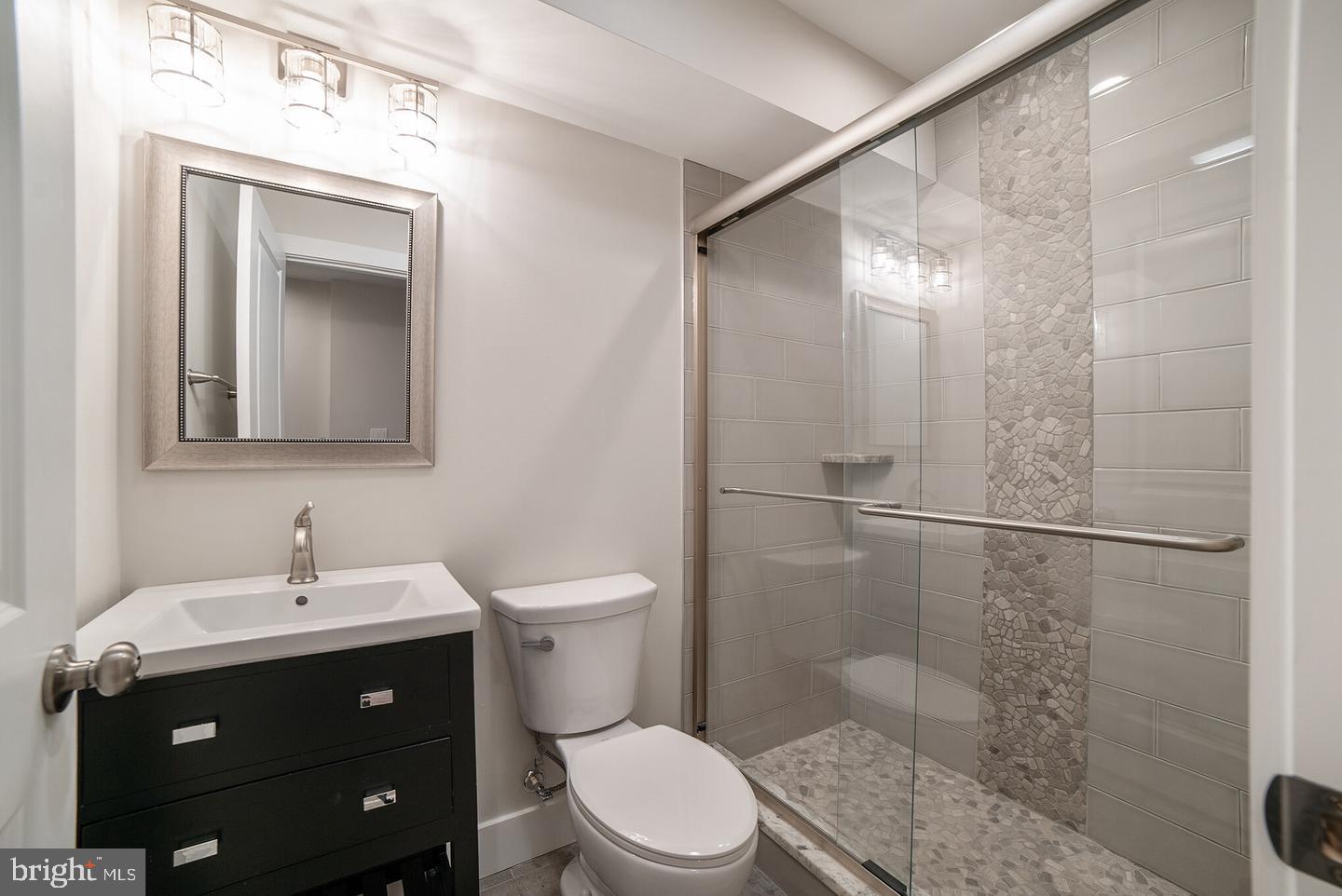 3425 O Donnell Street Baltimore, MD 21224 - Photo 25 of 29 a bathroom with a sink a toilet and shower