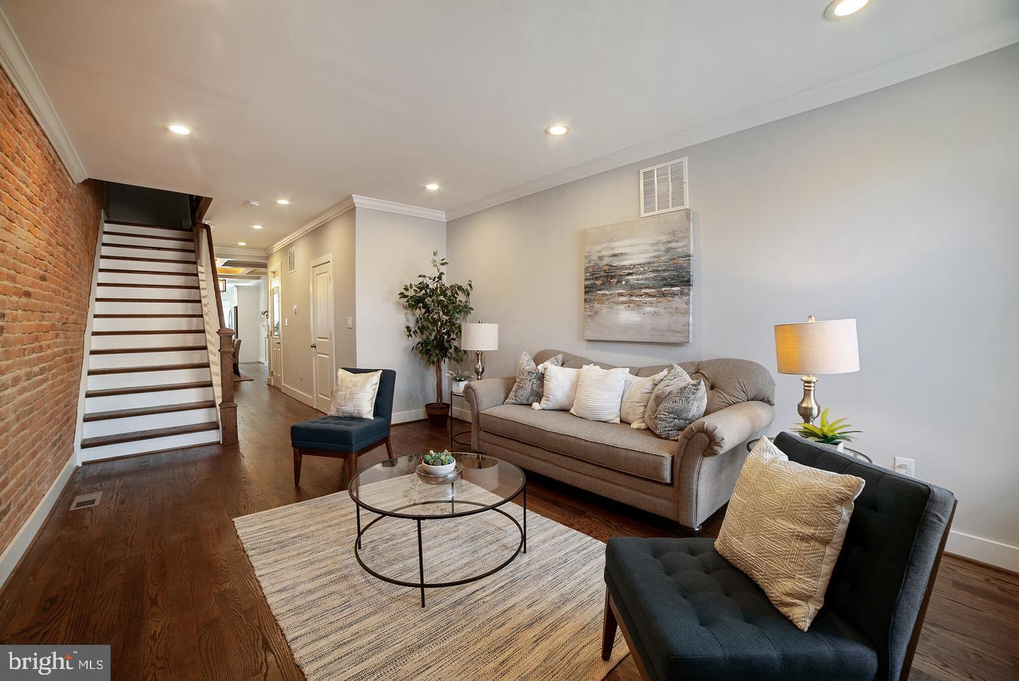 3425 O Donnell Street Baltimore, MD 21224 - Photo 3 of 29 a living room with furniture and wooden floor