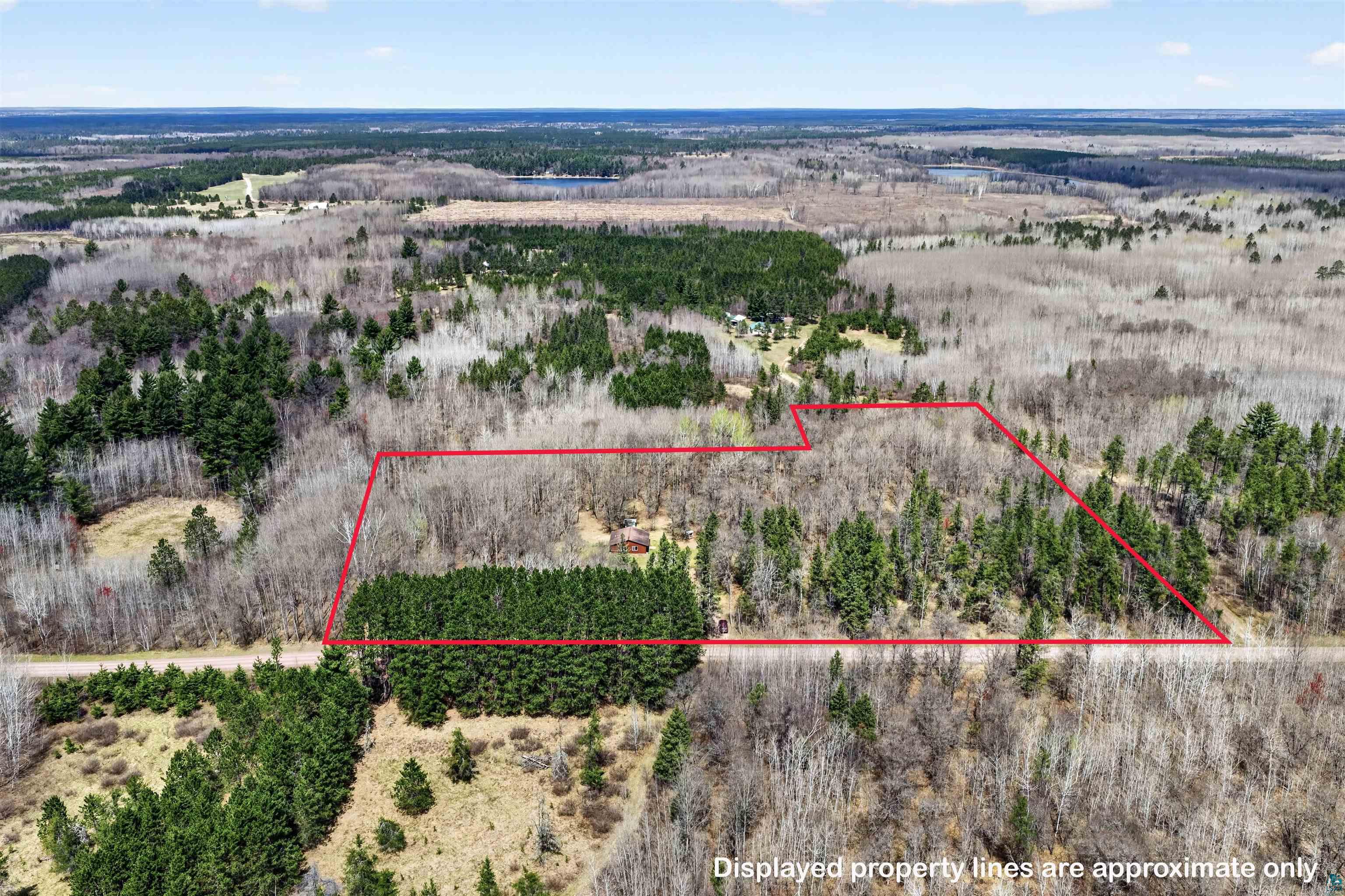 12235 East Crooked Lake Road Gordon, WI 54838 - Photo 44 of 48 Expansive parcel featuring mature trees, a mix of deciduous and evergreen foliage, and natural terrain