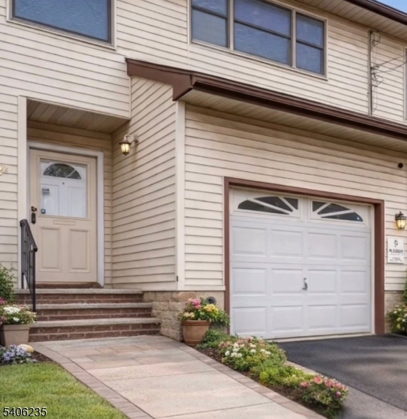 327 Bond Street Elizabeth Port, NJ 07206 - Photo 1 of 22 a front view of a house with a garage