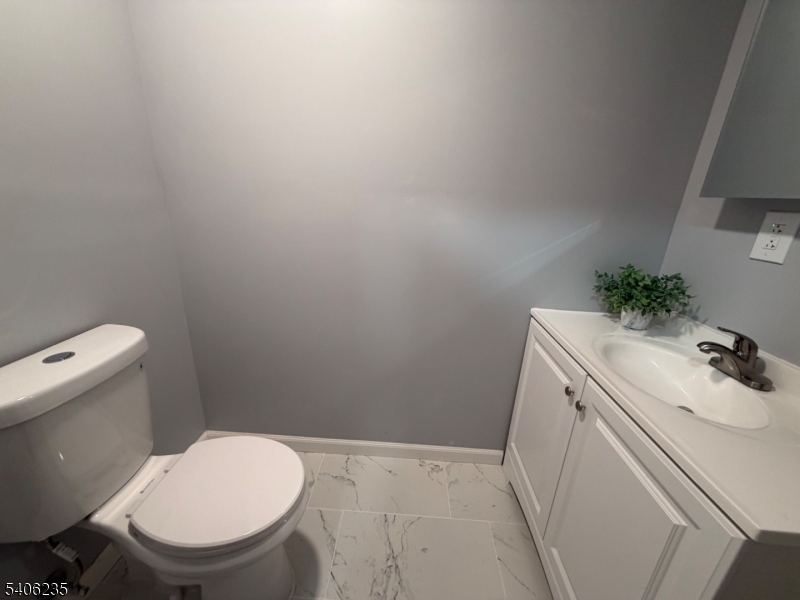 327 Bond Street Elizabeth Port, NJ 07206 - Photo 11 of 22 a bathroom with a sink and a toilet