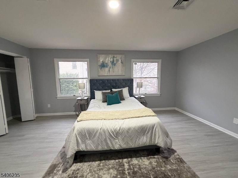327 Bond Street Elizabeth Port, NJ 07206 - Photo 13 of 22 a bedroom with a bed and window