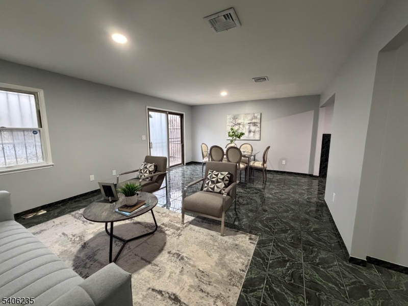 327 Bond Street Elizabeth Port, NJ 07206 - Photo 2 of 22 a living room with furniture and a window