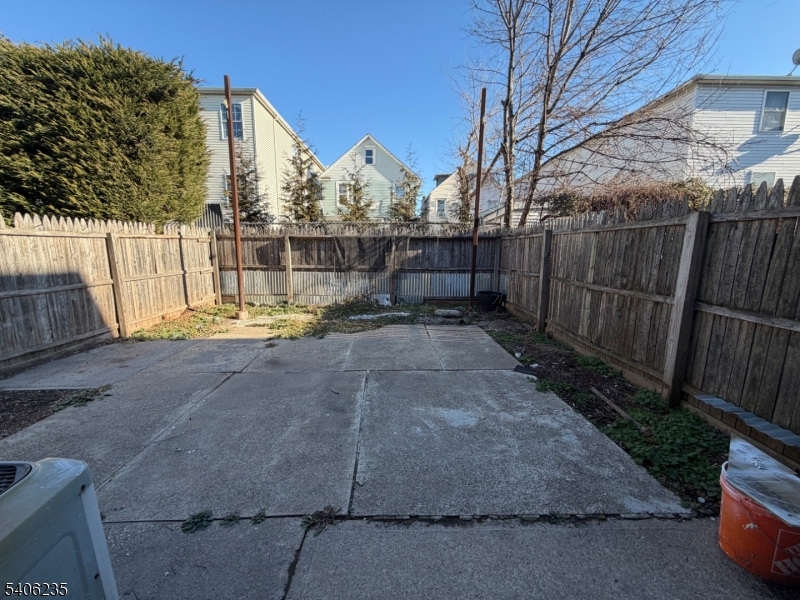 327 Bond Street Elizabeth Port, NJ 07206 - Photo 22 of 22 a view of small yard with wooden fence