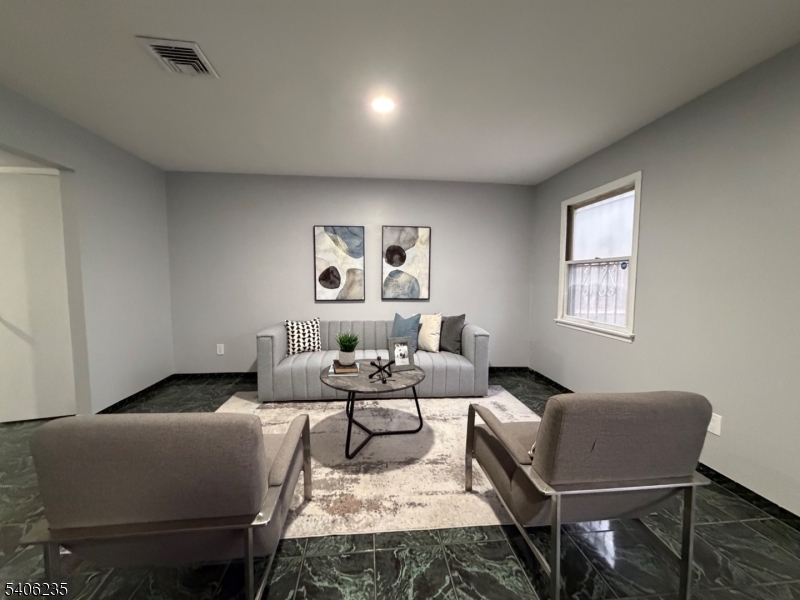 327 Bond Street Elizabeth Port, NJ 07206 - Photo 5 of 22 a living room with furniture and a window