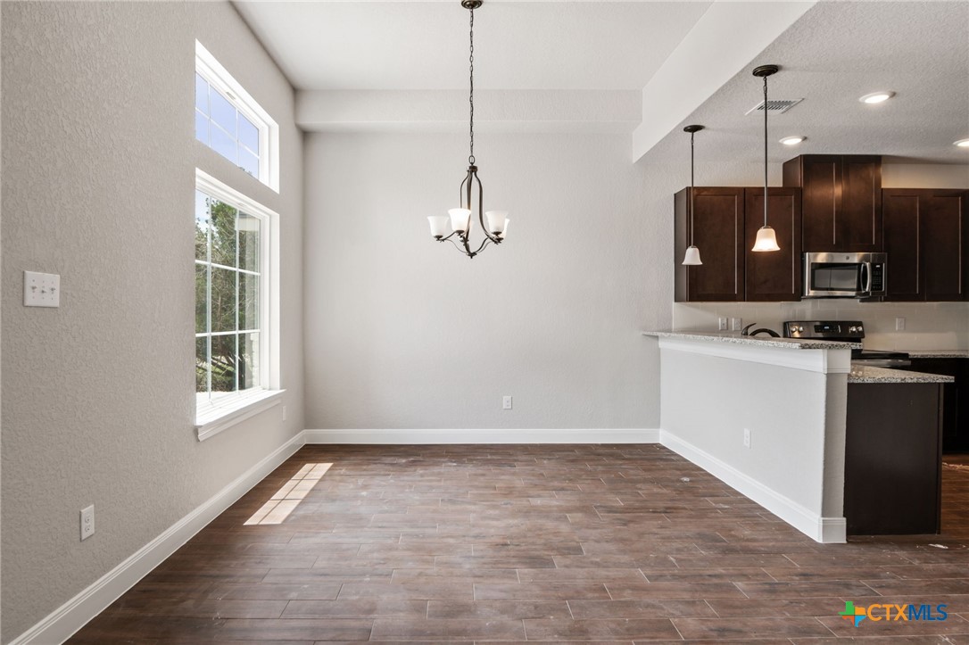 192 Weatherby Drive Spring Branch, TX 78070 - Photo 14 of 24 a view of a kitchen with a sink dishwasher and a microwave