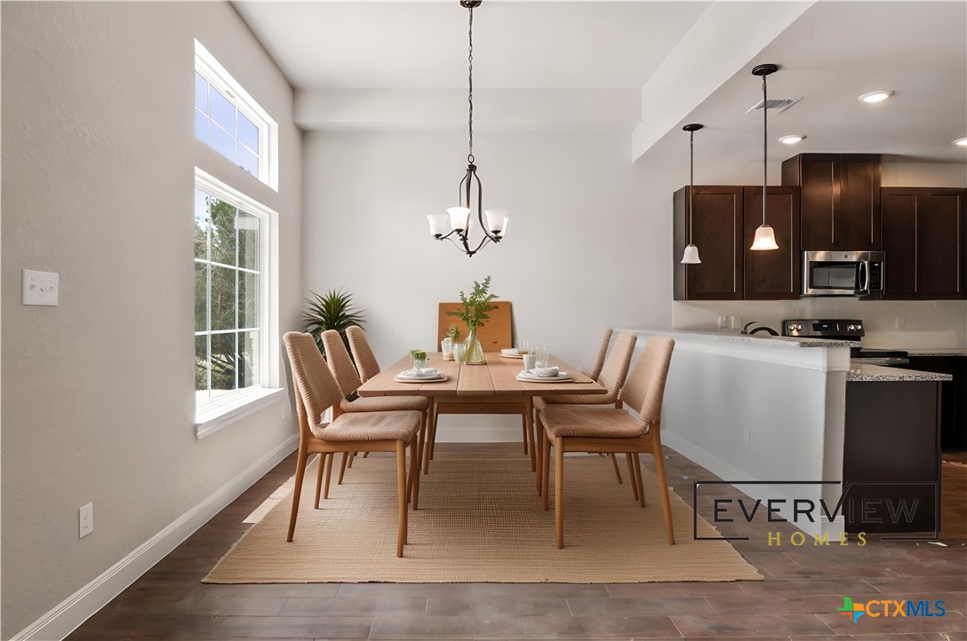 192 Weatherby Drive Spring Branch, TX 78070 - Photo 6 of 24 a dining room with furniture a window and wooden floor