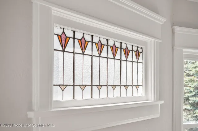 a kitchen with stainless steel appliances a stove a microwave a sink and cabinets