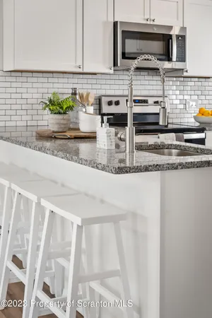 a close view of a faucet a sink and a window