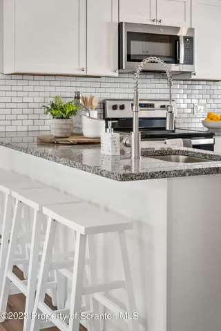a close view of a faucet a sink and a window