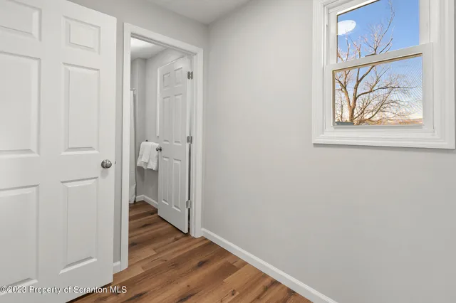 a view of an empty room and entryway