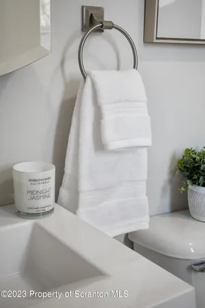 a living room with furniture and a lamp
