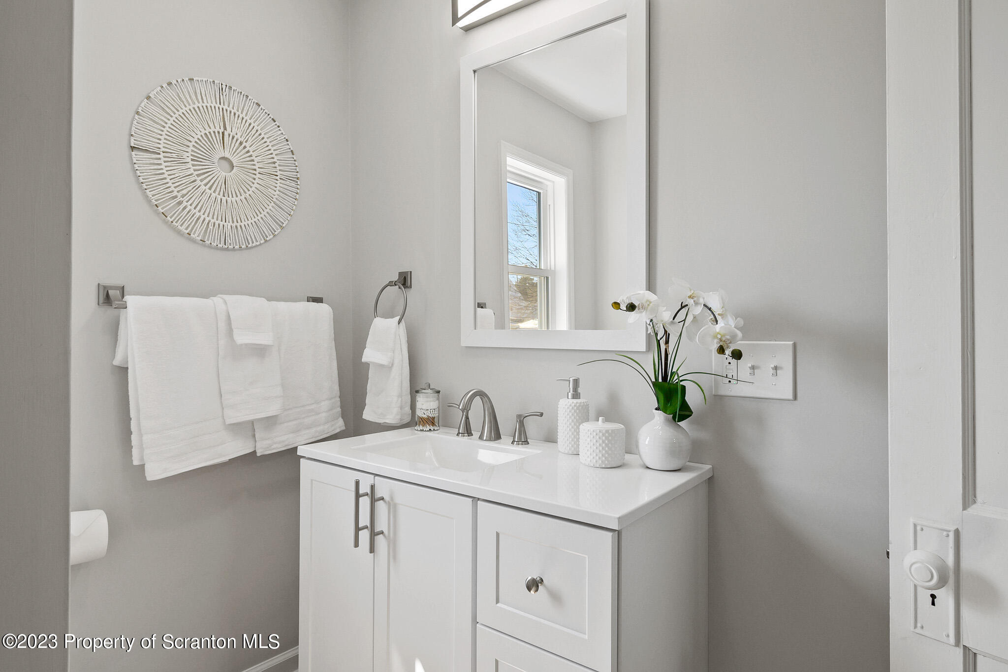 1605 Roosevelt Street Dunmore, PA 18512 - Photo 46 of 70 a bathroom with a sink and a mirror