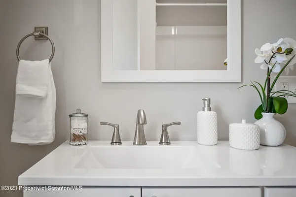 a view of a house with a wooden fence