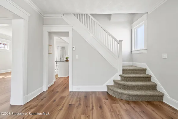 a room with fireplace and wooden floor