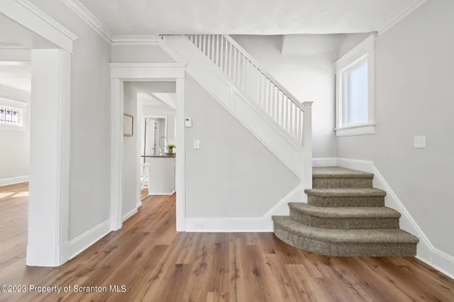 a room with fireplace and wooden floor