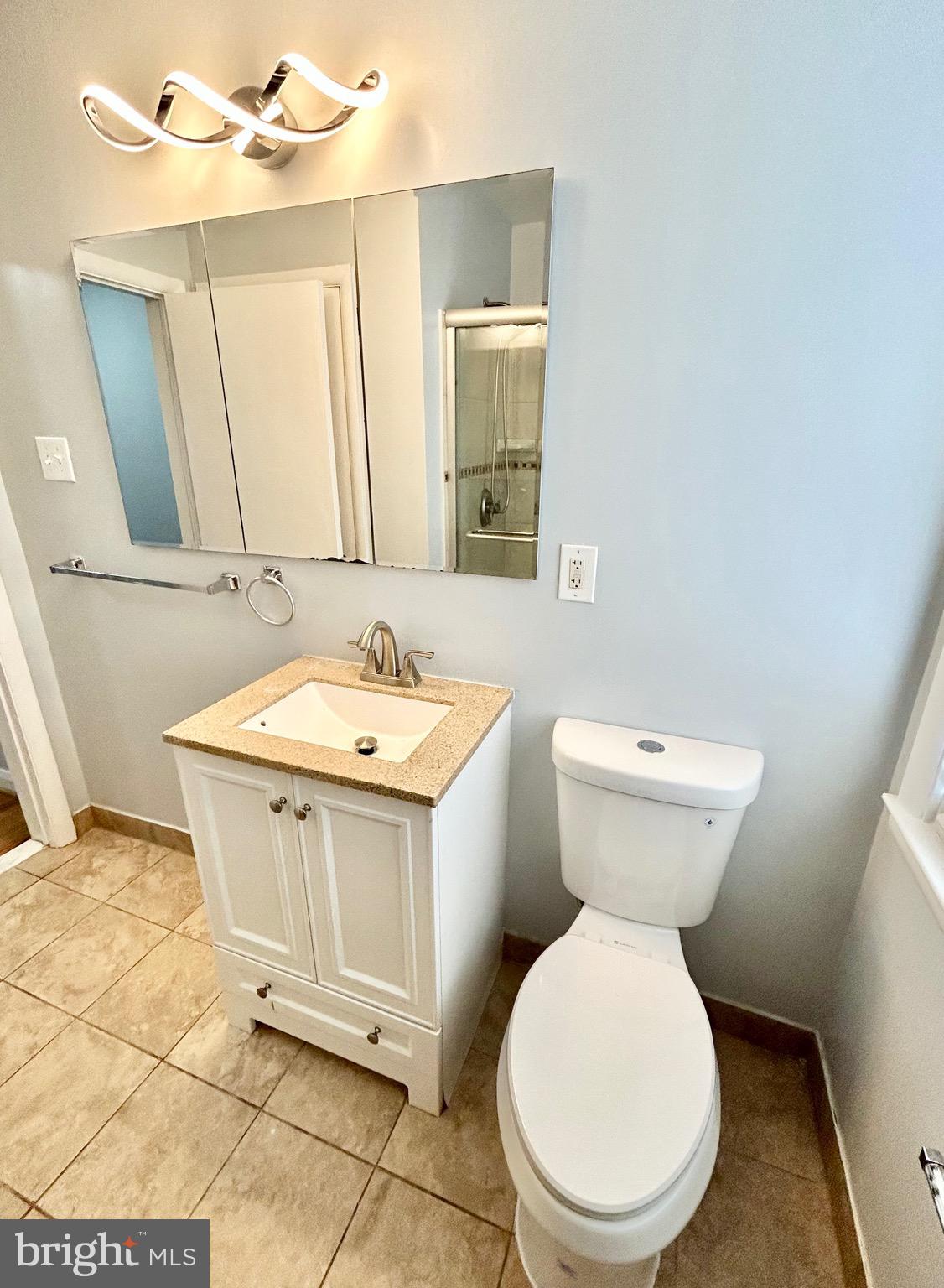 6116 Edlynne Road Baltimore, MD 21239 - Photo 10 of 18 a bathroom with a sink and a toilet