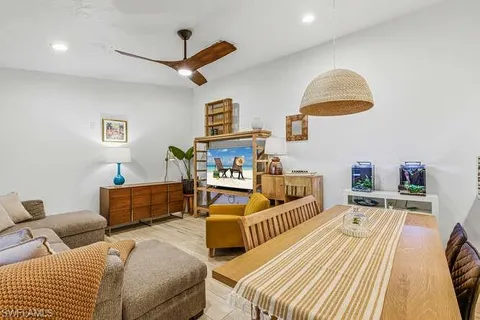 a bedroom with furniture and a wooden floor