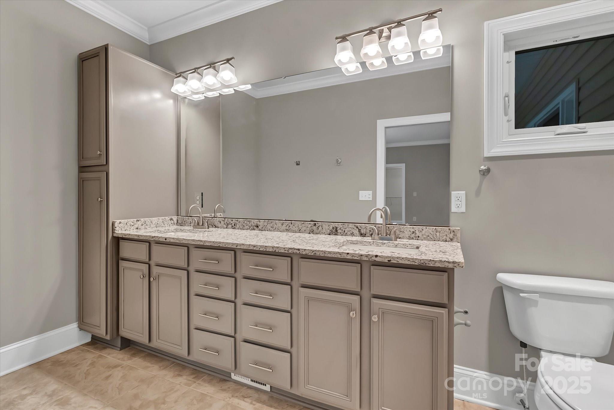 332 East Rebound Road Lancaster, SC 29720 - Photo 11 of 29 a bathroom with a granite countertop sink a toilet and a mirror